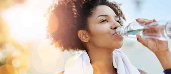 Healthy women drinking water